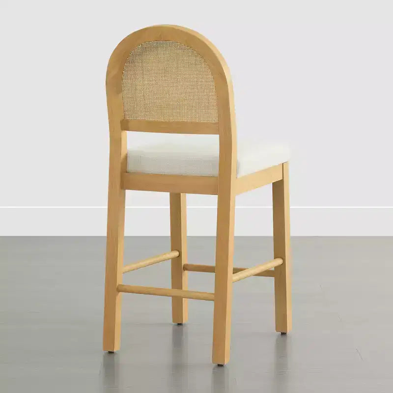 Tabouret de comptoir bohème en rotin avec dossier incurvé et assise coussinée