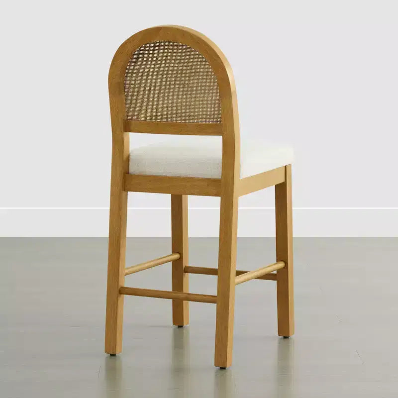Tabouret de comptoir bohème en rotin avec dossier incurvé et assise coussinée