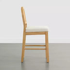 Tabouret de comptoir bohème en rotin avec dossier incurvé et assise coussinée