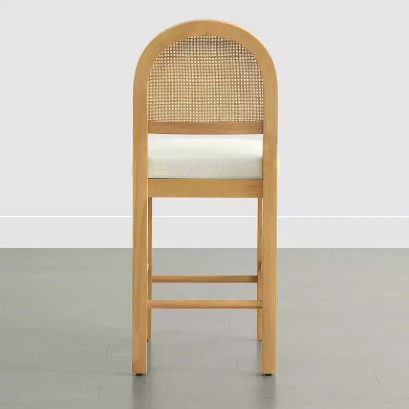 Tabouret de comptoir bohème en rotin avec dossier incurvé et assise coussinée